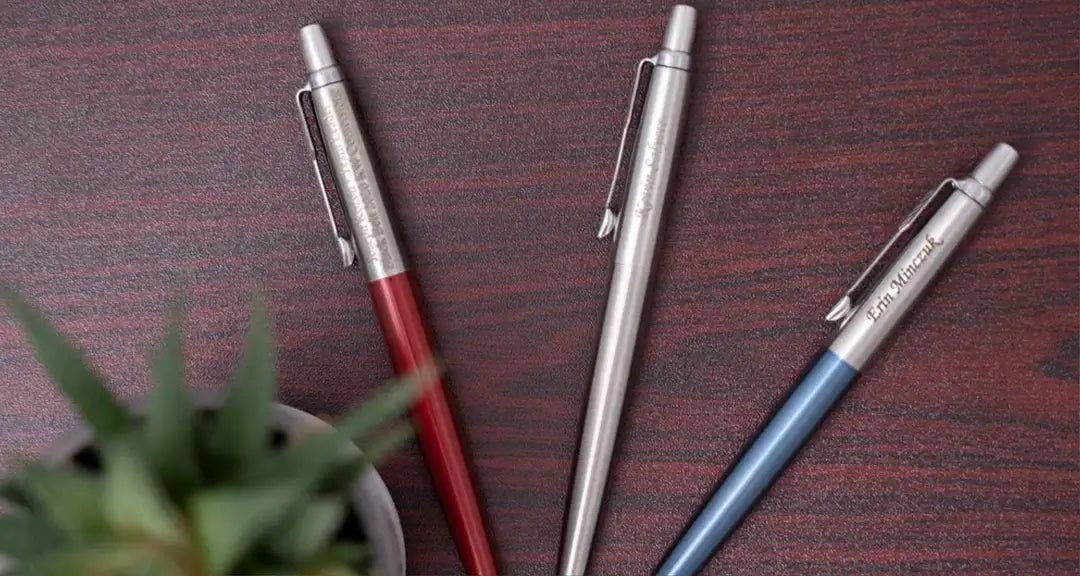 Three engraved parker jotter edc pens on a table